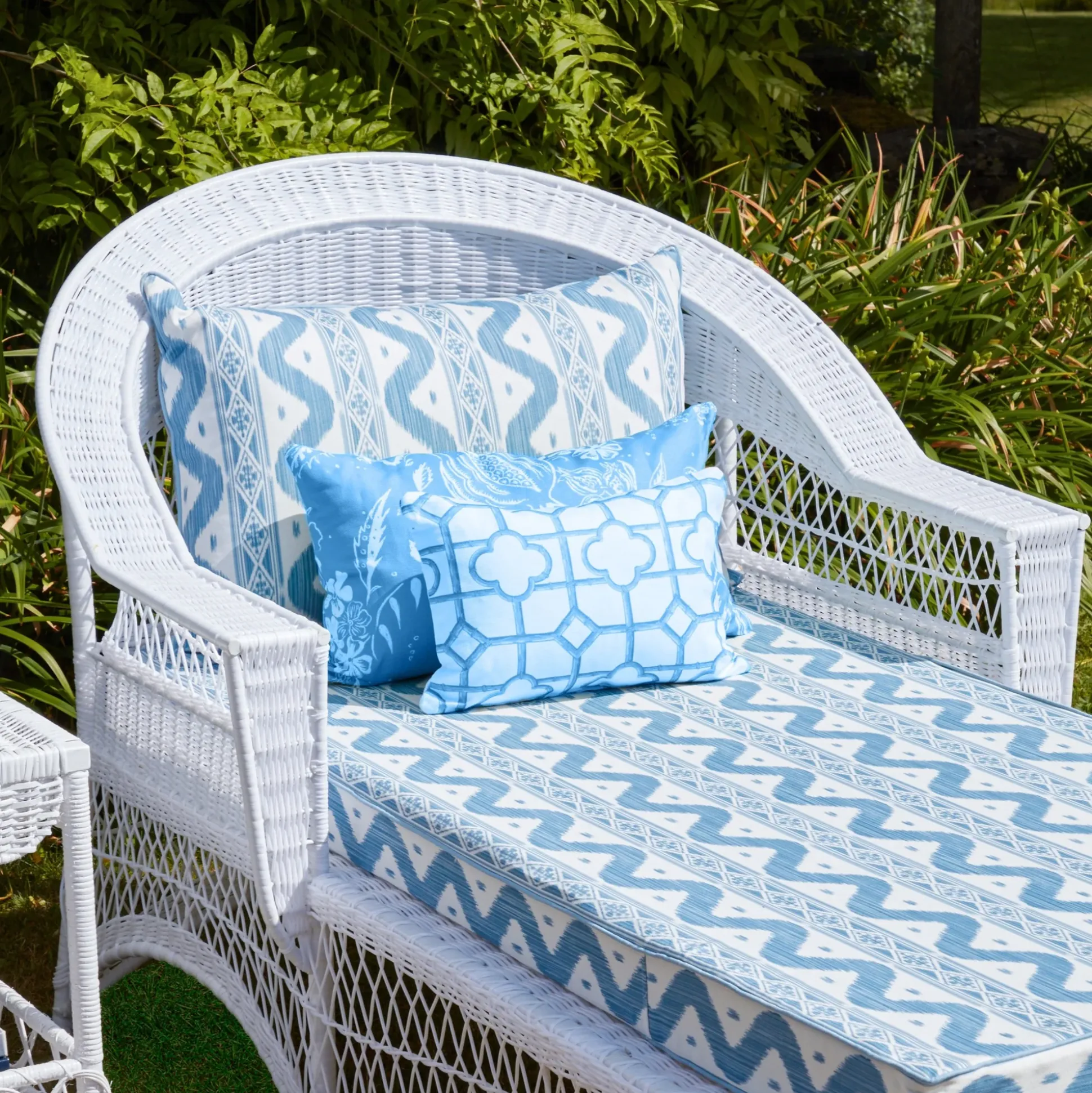 White Rattan Sun Lounger With Blue Ikat Cushion